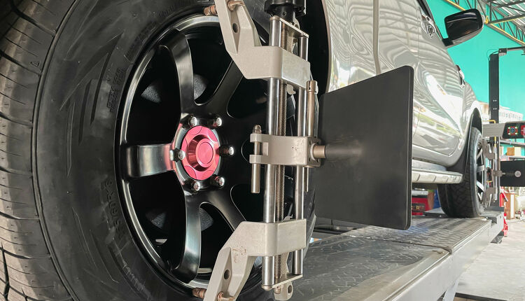 Wheel Alignments Car getting a wheel alignment Capital Tyres Hamilton - Drive through service