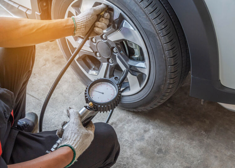 Nitrofill Tyre Inflation Man inflating a tyre with Nitrofill Capital Tyres Hamilton - Drive through service